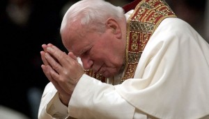 Pope John Paul II prays during Mass in 2003